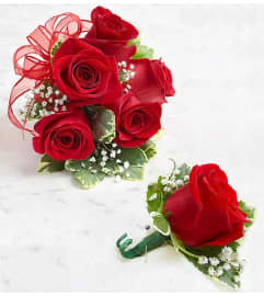 Red Rose Corsages. An arrangement by Brickell Exclusive Blooms. Red Rose Corsages. An arrangement by Brickell Exclusive Blooms.