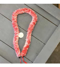 ribbon lei #47. An arrangement by Royal Louis Florist.