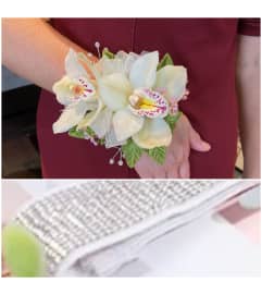 So Elegant Orchid Wrist Corsage. An arrangement by Avenue Florist.