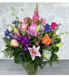 Bright and Beautiful As You. An arrangement by Massey's House of Flowers.