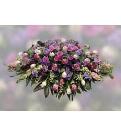 Casket Spray of Pink Lav and Purple. An arrangement by Massey's House of Flowers.