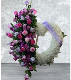 Cluster Pink and Lav Rose open heart. An arrangement by Massey's House of Flowers.