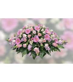 Shades of Pink Casket. An arrangement by Massey's House of Flowers.