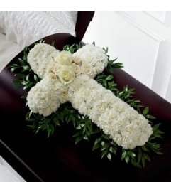 Peaceful Memories Casket. An arrangement by Conny's Flower Shop.