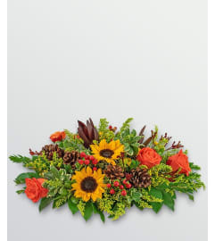 THANKSGIVING LONG CENTERPIECE. An arrangement by Conny's Flower Shop.