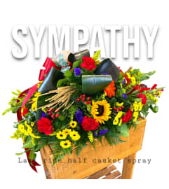 RUSTIC Last Ride Casket spray. An arrangement by Rustic Floral and Gifts.
