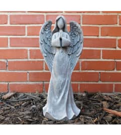 Contemporary Angel Statue. An arrangement by Sueppel's Flowers.