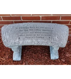 Perhaps They Are Not Stars Stone Memorial Bench. An arrangement by Sueppel's Flowers.