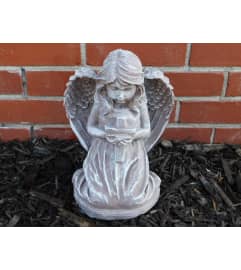 Angel with Cross Statue. An arrangement by Sueppel's Flowers.