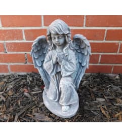 Floral Robe Angel Statue. An arrangement by North Liberty Flower Shop. Floral Robe Angel Statue. An arrangement by North Liberty Flower Shop.