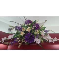 Cemetery Saddles. An arrangement by KW Flowers.