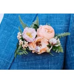 Pocket Flower Flair / Boutonniere. An arrangement by Flowers by Priscilla. Pocket Flower Flair / Boutonniere. An arrangement by Flowers by Priscilla.