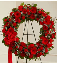 Garden All Red Wreath. An arrangement by Garden Florist.