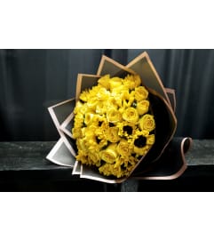 Yellow Rose and Sunflower Buchon Bouquet. An arrangement by BellaRosa Gardens.