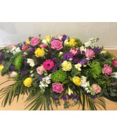 Colorful Mixed Casket Spray. An arrangement by Northwest Florist.