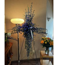 Blue for You Cross. An arrangement by The Farm and Floral Market.