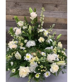 Faithful Ivory Urn Wreath. An arrangement by The Farm and Floral Market.