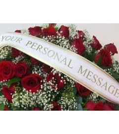 CustomBanner. An arrangement by The Flower Patch Florist.