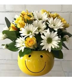 Happy Face Bowl of Assorted flowers. An arrangement by Flowers by Priscilla. Happy Face Bowl of Assorted flowers. An arrangement by Flowers by Priscilla.
