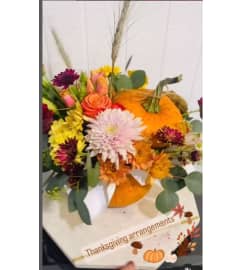 Autumn Punkin. An arrangement by Geni's Florist and Gifts.