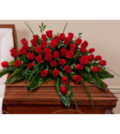 Clasic Red Roses Casket Spray. An arrangement by Garden Florist.