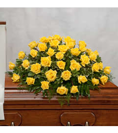 Classic Yellow Rose Casket Spray. An arrangement by Garden Florist.