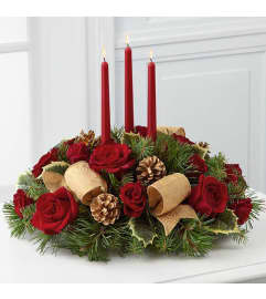 3 CANDLE CENTERPIECE. An arrangement by J.D. Ballantine's Flowers and Gifts.