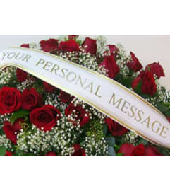 Tribute Memorial Banner. An arrangement by Salinas Floral and Gifts.