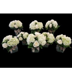 All White Event Centerpieces. An arrangement by Hours of Flowers.
