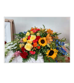 Warm Thoughts Casket Spray. An arrangement by Sanger Flowers.