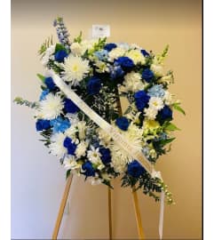 Heavenly Skies Wreath. An arrangement by Geni's Florist and Gifts.