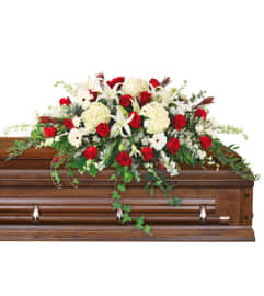 Peace Always Casket Spray by FSN. An arrangement by Flowerdale by Patty.
