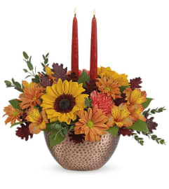 ROUND FALL CENTERPICE 2 CANDLE. An arrangement by Conny's Flower Shop.
