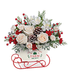 White Winter Sleigh. An arrangement by Tallevast Florist.