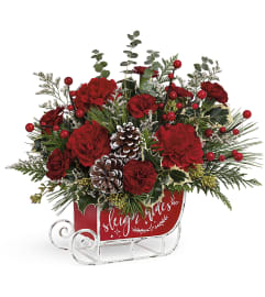 Van Veghel's Teleflora's Vintage Sleigh Ride. An arrangement by Van Veghel's Flowers.