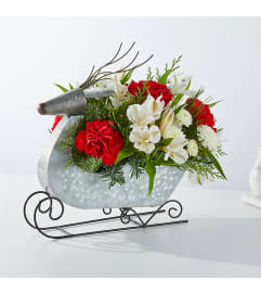 Tin Sleigh Bouquet. An arrangement by Rennix Flowers.