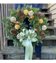 Aromatic Holiday Wreath. An arrangement by Violeta's Flower Shop.