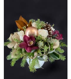 Sugar Plum Present. An arrangement by Hillcrest Florist.