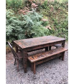 Dining Room Table Constructed from 125+ year Old Barn Wood. An arrangement by Thurston Flowers.