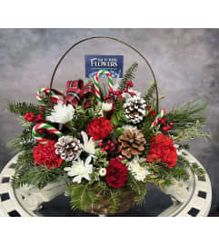 Yuletide Basket of Joy. An arrangement by Say It With Flowers.
