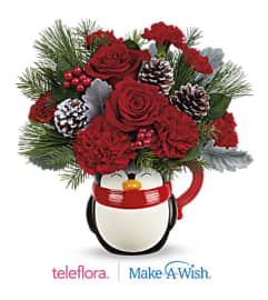 Send A Hug North Pole Penguin Mug. An arrangement by Margaret's Florist.