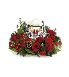 Thomas Kinkade's Sweet Sounds Of Christmas Centerpiece. An arrangement by Susana's Flowers.