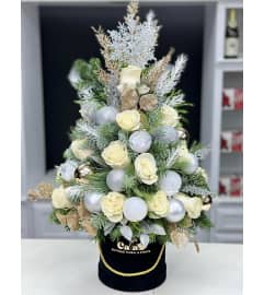 Christmas Tree Box *Christmas White*. An arrangement by Cala's Boutique Floral.