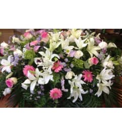 Beautiful Tribute Half Casket Spray. An arrangement by Jenilyn's Creations.