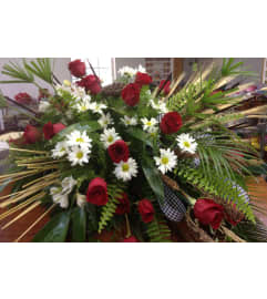 Woodland Bama Half Casket Spray. An arrangement by Jenilyn's Creations.