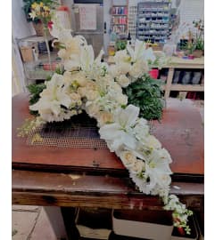 Beautiful in White Cross Spray. An arrangement by Jenilyn's Creations.