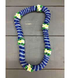 ribbon lei #59. An arrangement by Royal Louis Florist.