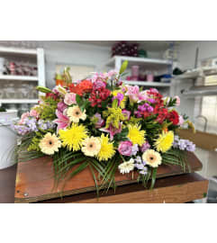 Grateful Heart Half Casket Spray. An arrangement by Jenilyn's Creations.