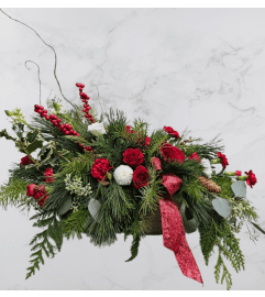 A perfect Christmas gift. An arrangement by Harriet's Flower and Gift Shop.