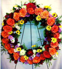 Circle of Life Wreath Spray. An arrangement by Jenilyn's Creations.
